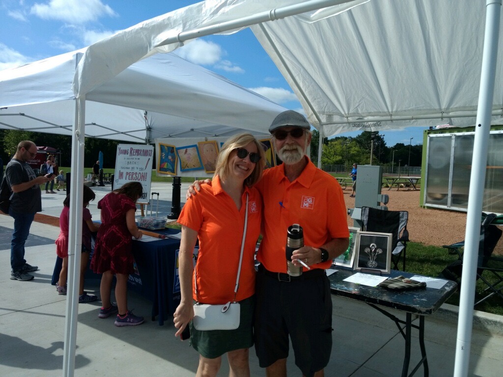 Guild members at Silent Auction tent at Art in the Park at Village Park
