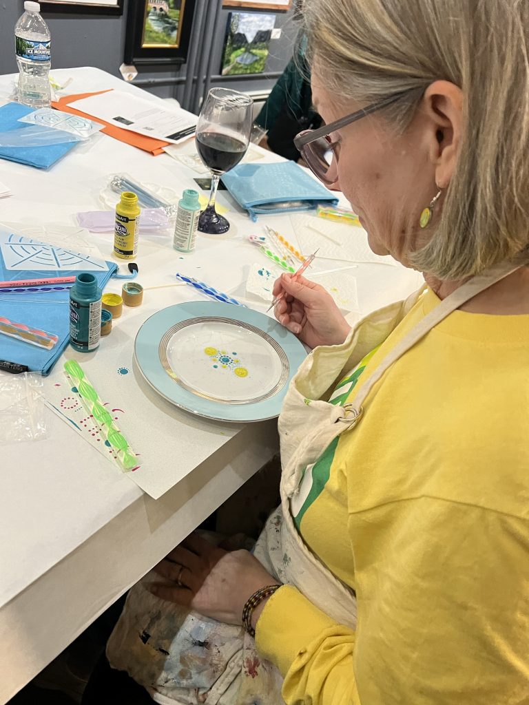Photo of Art Guild member Beth participating in The Dotting Chick's workshop during the March member meeting.
